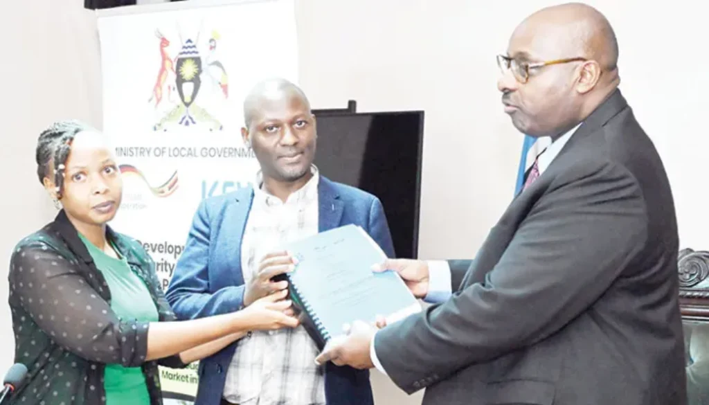Local-Govt-ministry-PS-Ben-Kumamanya-R-hands-the-contract-to-UB-Consulting-officials